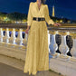 Elegant long-sleeved blouse with V-neckline and wide sequinned jumpsuit trousers