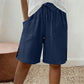 🩳✨ Shorts feminino de verão com cintura ajustável e detalhe elegante de botões laterais